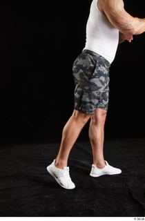 Grigory  1 camo shorts dressed flexing leg side view…